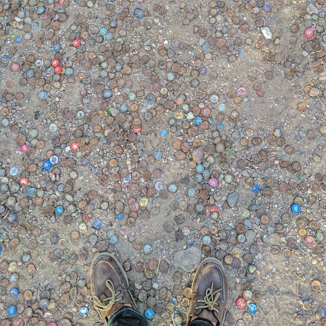 Bottle cap parking lot outside Lost Horse Saloon