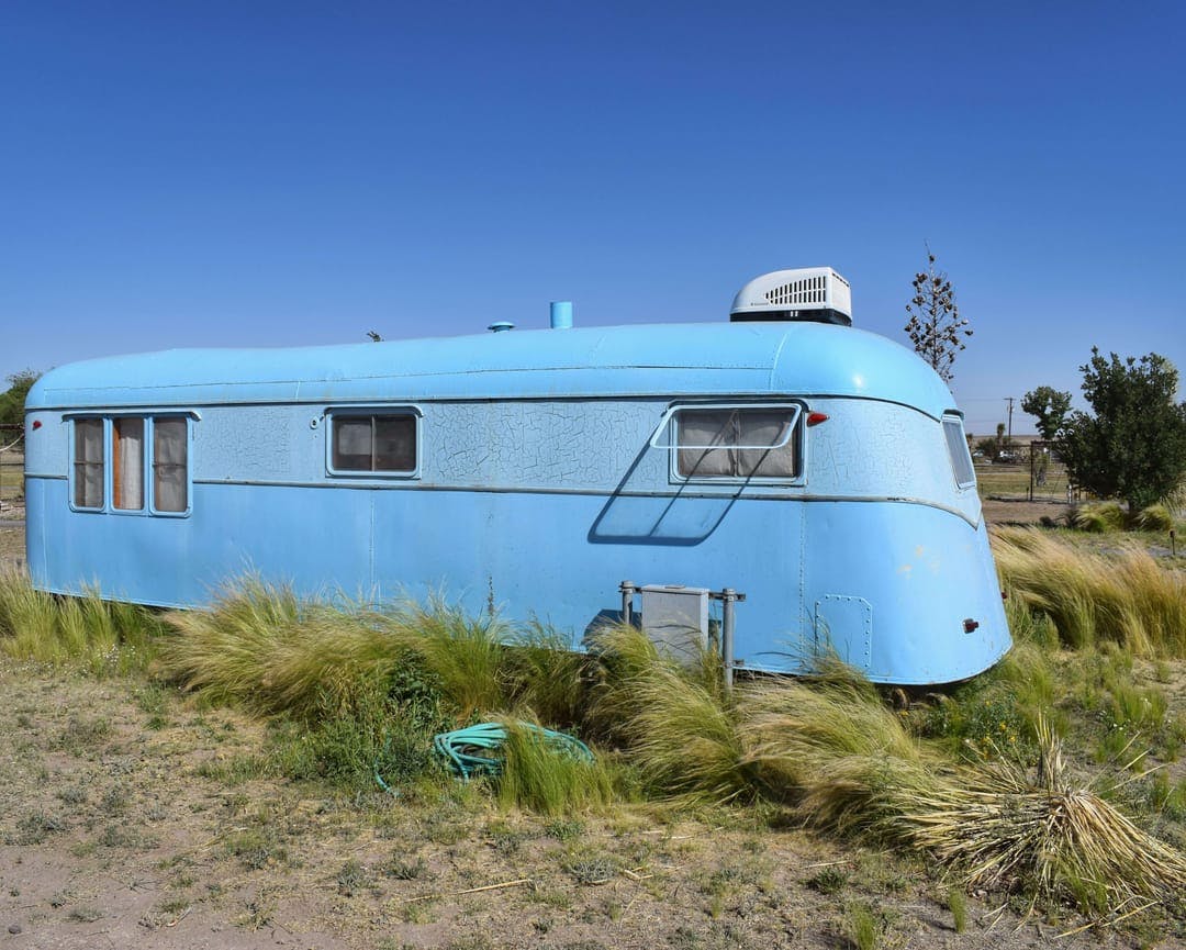 Fancy renovated camper with AC. And its own hose?