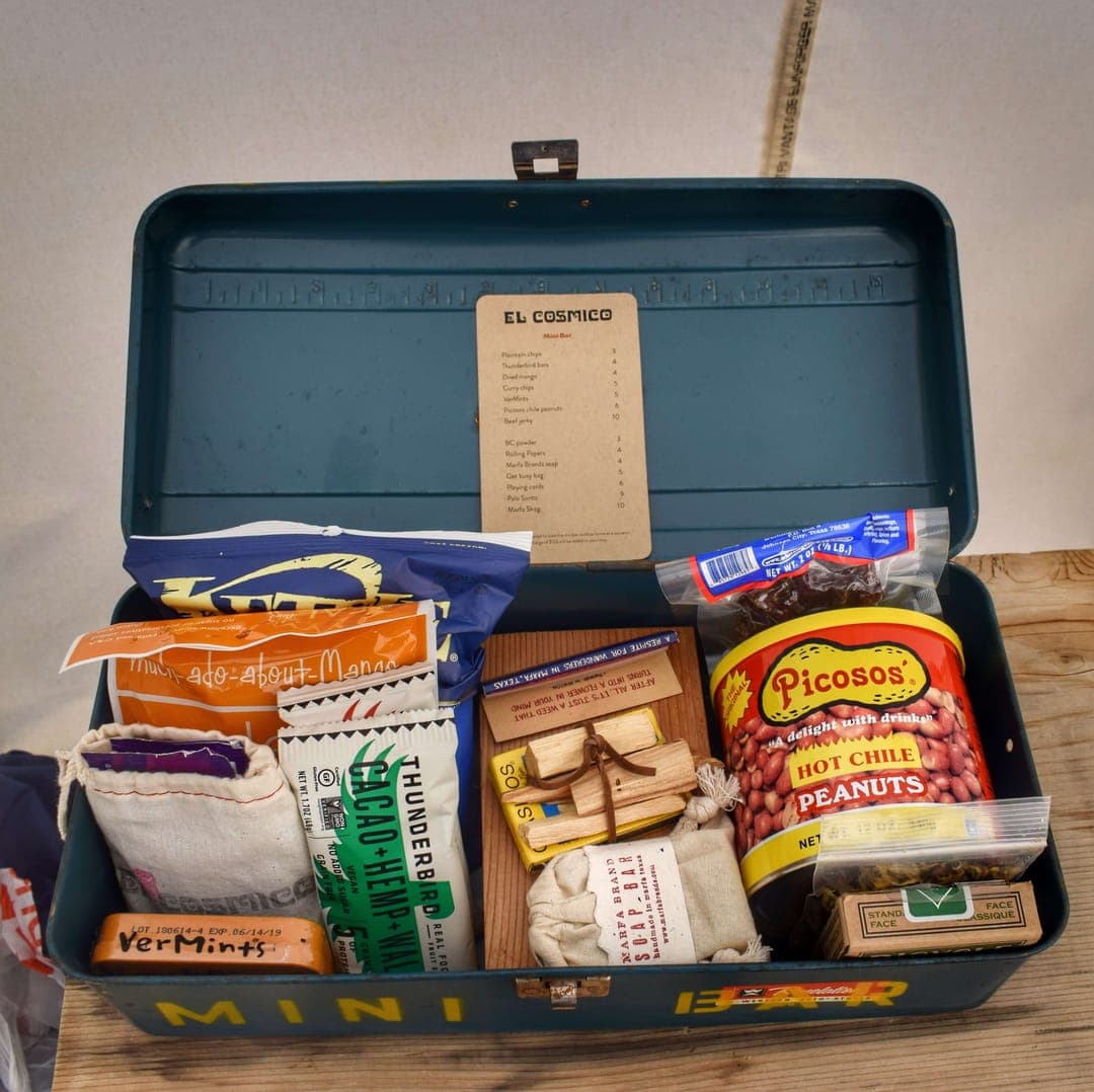 The minibar at El Cosmico is in a tackle box and includes rolling papers, a "Marfa Shag" dime bag, and a "Get busy bag" with condoms and Astroglide.